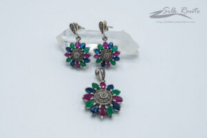 Traditional flower pattern pendant & earrings set in sterling silver embellished with blue/fuchsia/green quartz